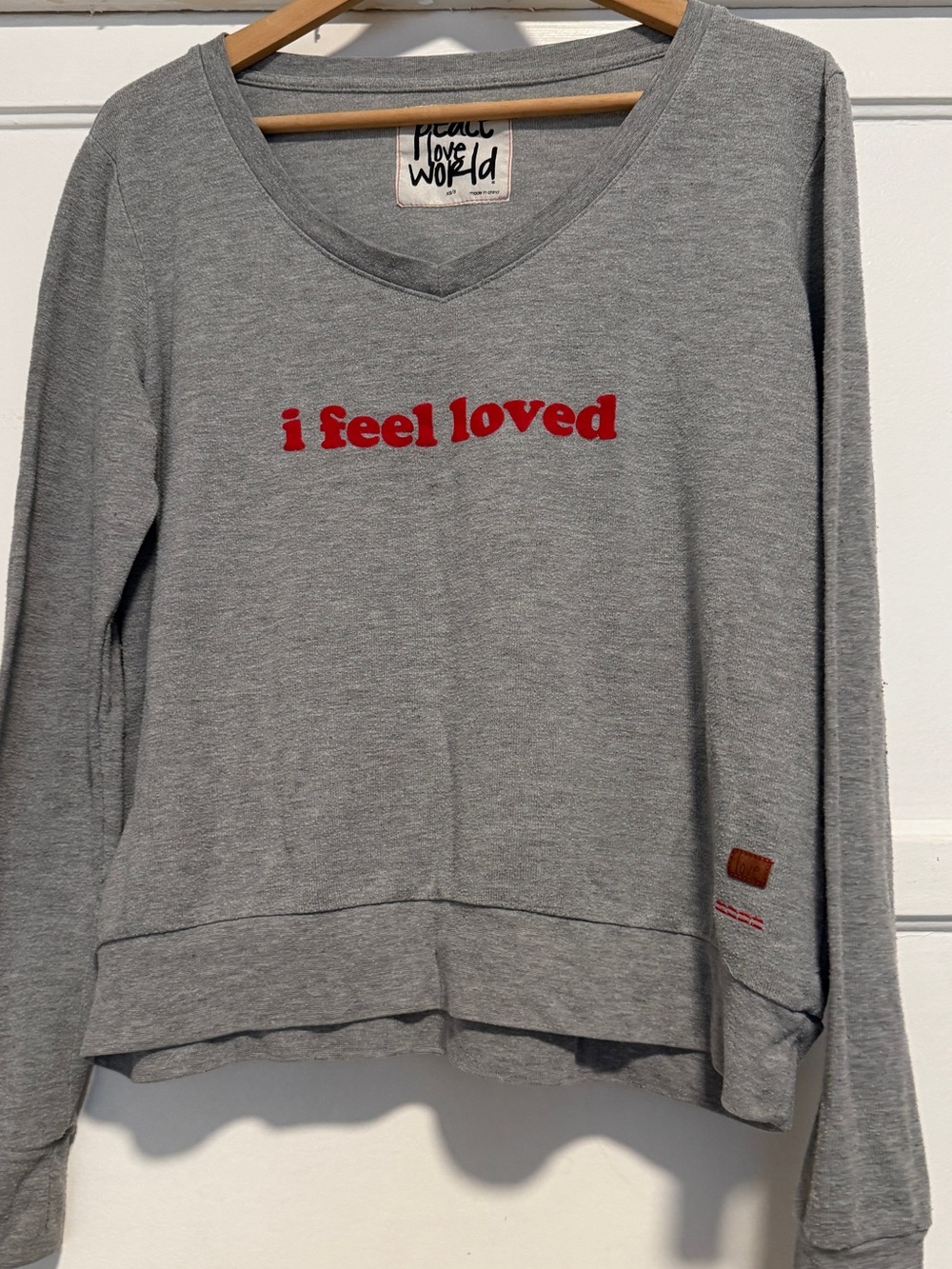 Peace Love World Gray V-Neck Sweater with Red "i feel loved" Embroidery